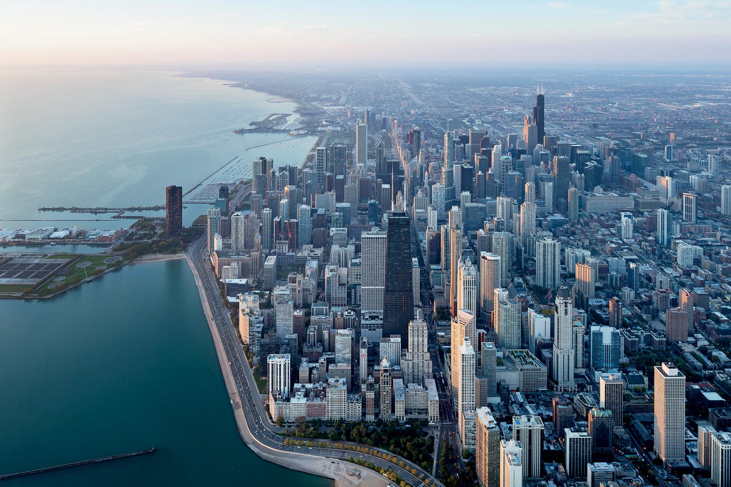 Chicago skyline at dusk through an elevator window